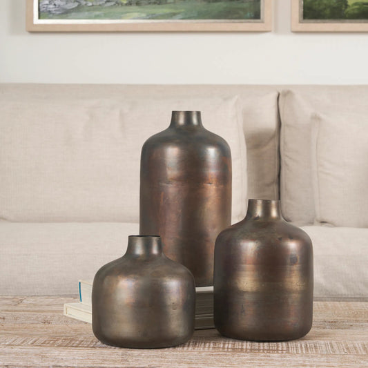 Daya Antiqued Vase by Mercana in gold. Made from metal in a rustic style.