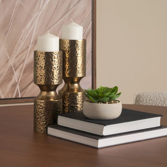Akira Hammered Gold Pillar Candle Holder by Mercana in antiqued gold. Made from metal in a rustic style.