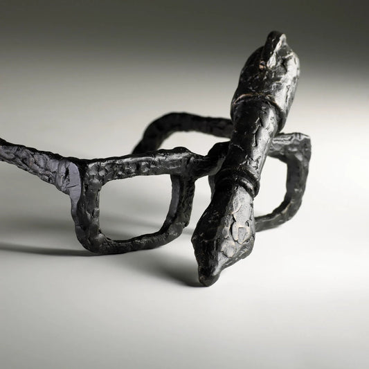 Sculptured Spectacles by Cyan Design in old world. Made from iron in a modern style.