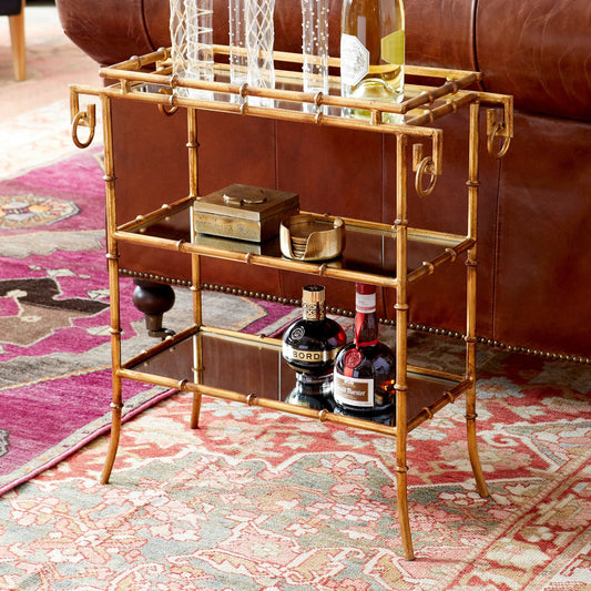 Bamboo Bar Cart by Cyan Design in gold. Made from iron, mirrored glass in a eclectic & global style.