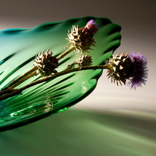 Art Glass Plate by Cyan Design in turquoise. Made from glass in a modern style.