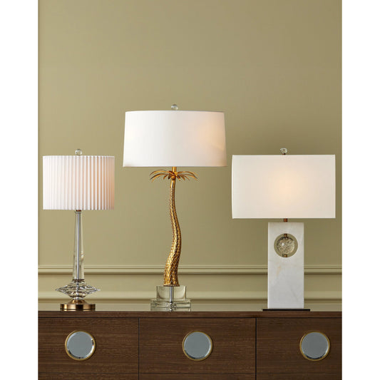 Anton Table Lamp by Currey and Company in clear, antique brass. Made from optic crystal, metal in a modern style.