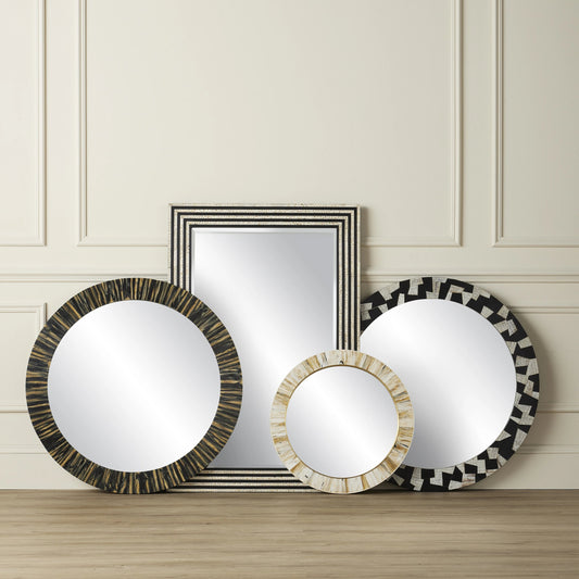 Niva Round Wall Mirror by Currey and Company in cream, brass, mirror. Made from composite, brass, glass, engineered hardwood in a modern style.