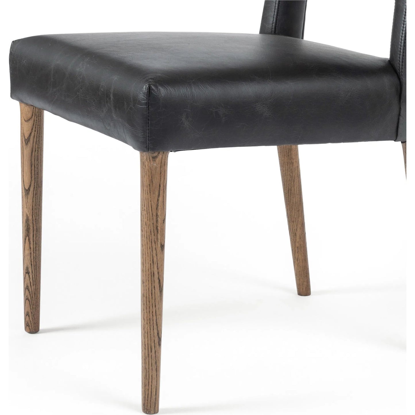 007 SI-2462029 | Closeup | Joseph Dining Chair by Four Hands in durango smoke, toasted oak. Made from top grain leather, solid oak in a traditional style.