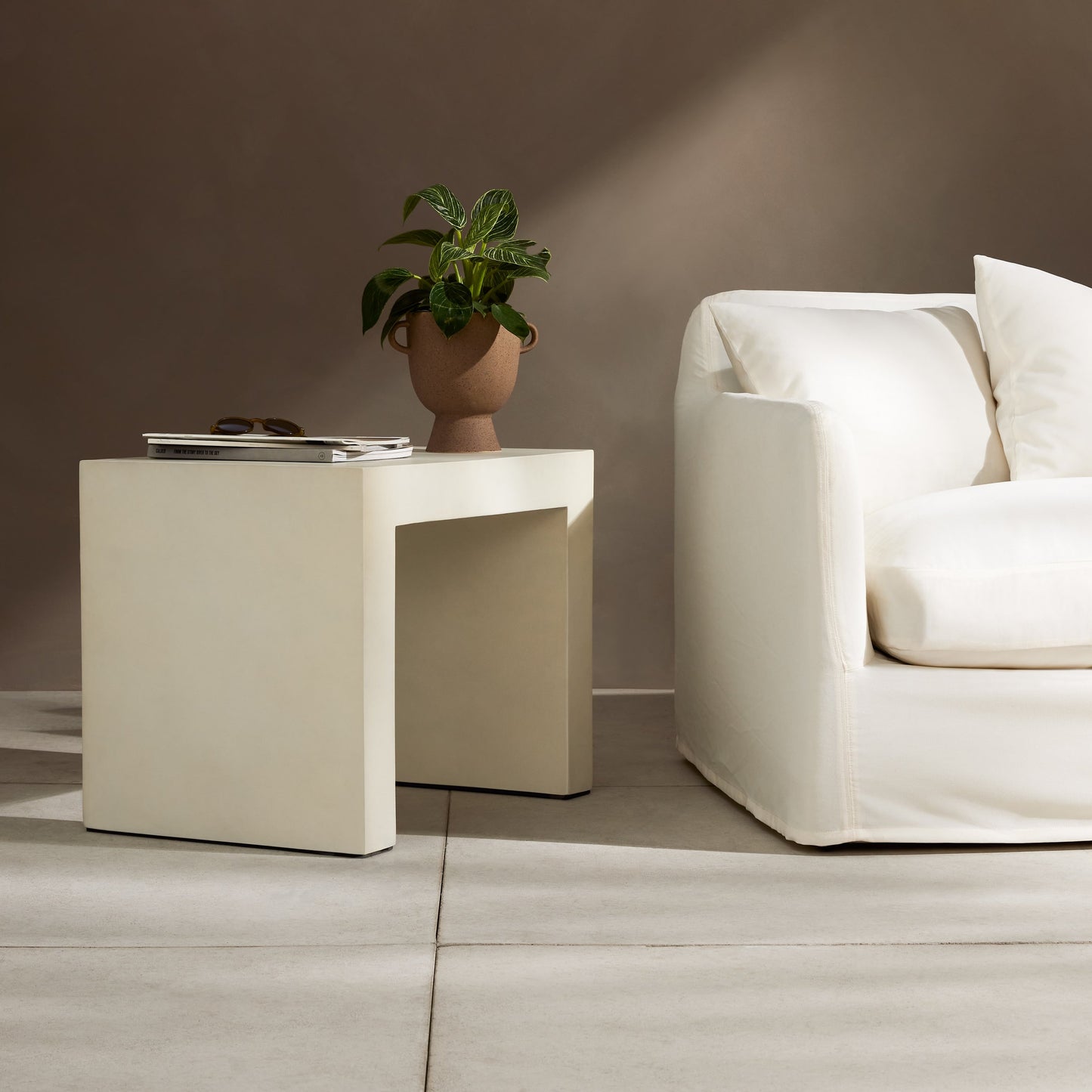 011 SI-1902505 | Lifestyle | Parish Outdoor End Table by Four Hands in white. Made from concrete in a transitional style.
