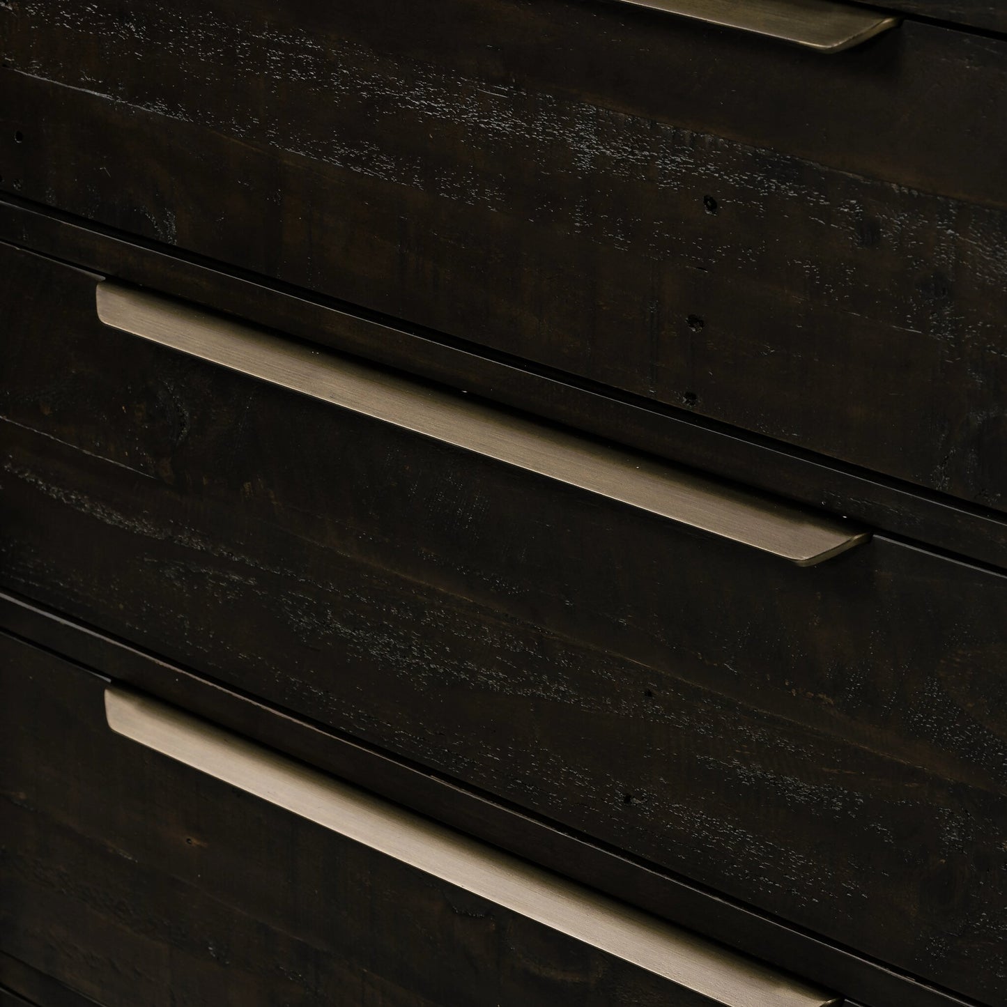 008 SI-2158598 | Closeup | Wyeth 5 Drawer Dresser by Four Hands in dark carbon, antique brass and dark carbon. Made from solid reclaimed pine, iron in a rustic style.
