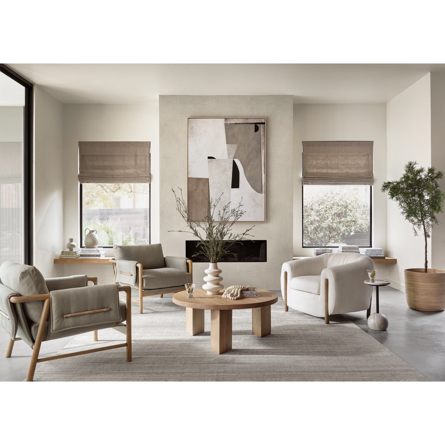 017 SI-1716107 | Lifestyle | Mesa Round Coffee Table by Four Hands in light brushed parawood. Made from solid parawood in a eclectic & global style.