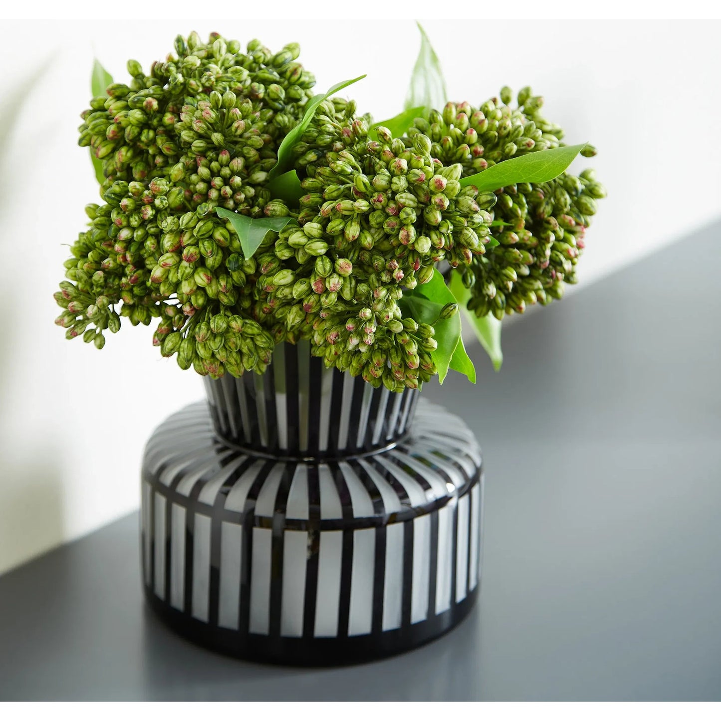 004 SI-1987192 | Lifestyle | Lined Up Vase by Cyan Design in black. Made from glass in a modern style.