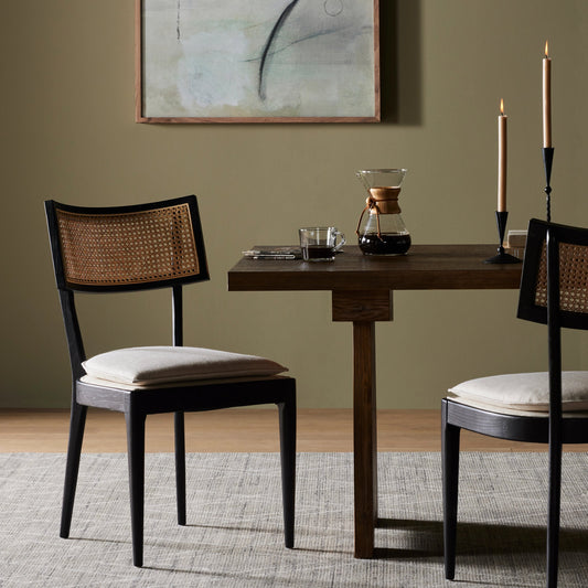 Britt Dining Chair by Four Hands in natural cane, savile flax, brushed ebony. Made from 92% polyester, 8% flax, linen, solid nettlewood, cane in a modern style.
