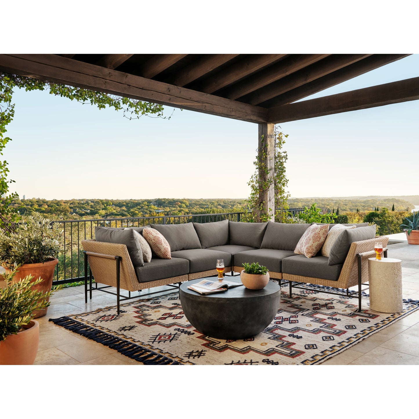 021 SI-1714367 | Lifestyle | Basil Outdoor Round Coffee Table by Four Hands. Made from aluminum in a modern style.