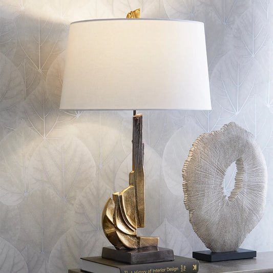 Crescendo Table Lamp by Cyan Design in antique brass. Made from aluminum in a modern style.
