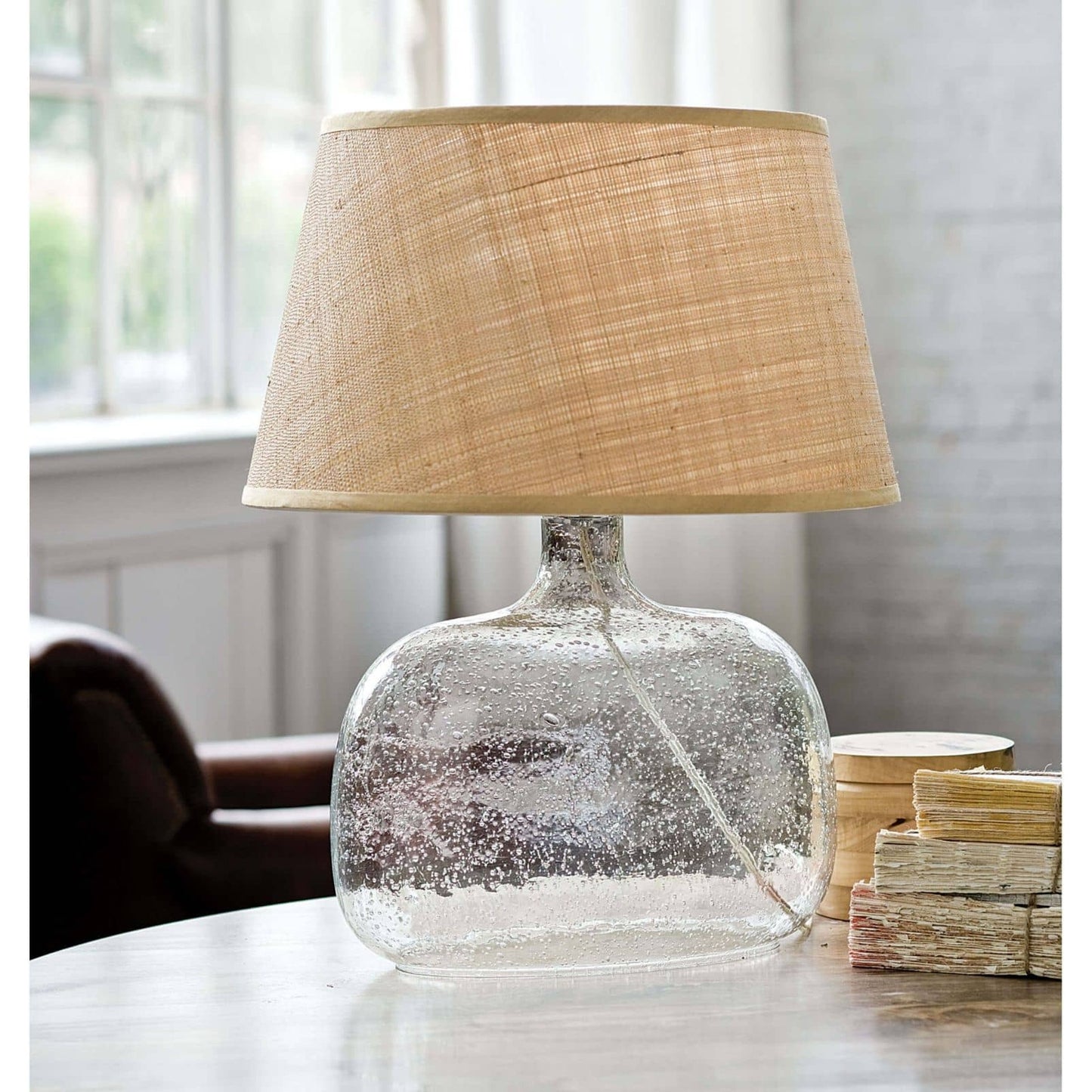 005 S-287264 | Lifestyle | Seeded Oval Glass Table Lamp by Regina Andrew in clear and clear. Made from glass in a coastal style.