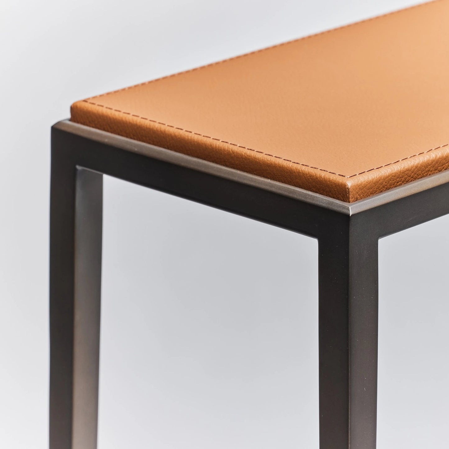 006 SI-2122642 | Closeup | Auburn Small Console by Interlude Home in classic bronze, caramel. Made from wood, cast iron, leather in a modern style.