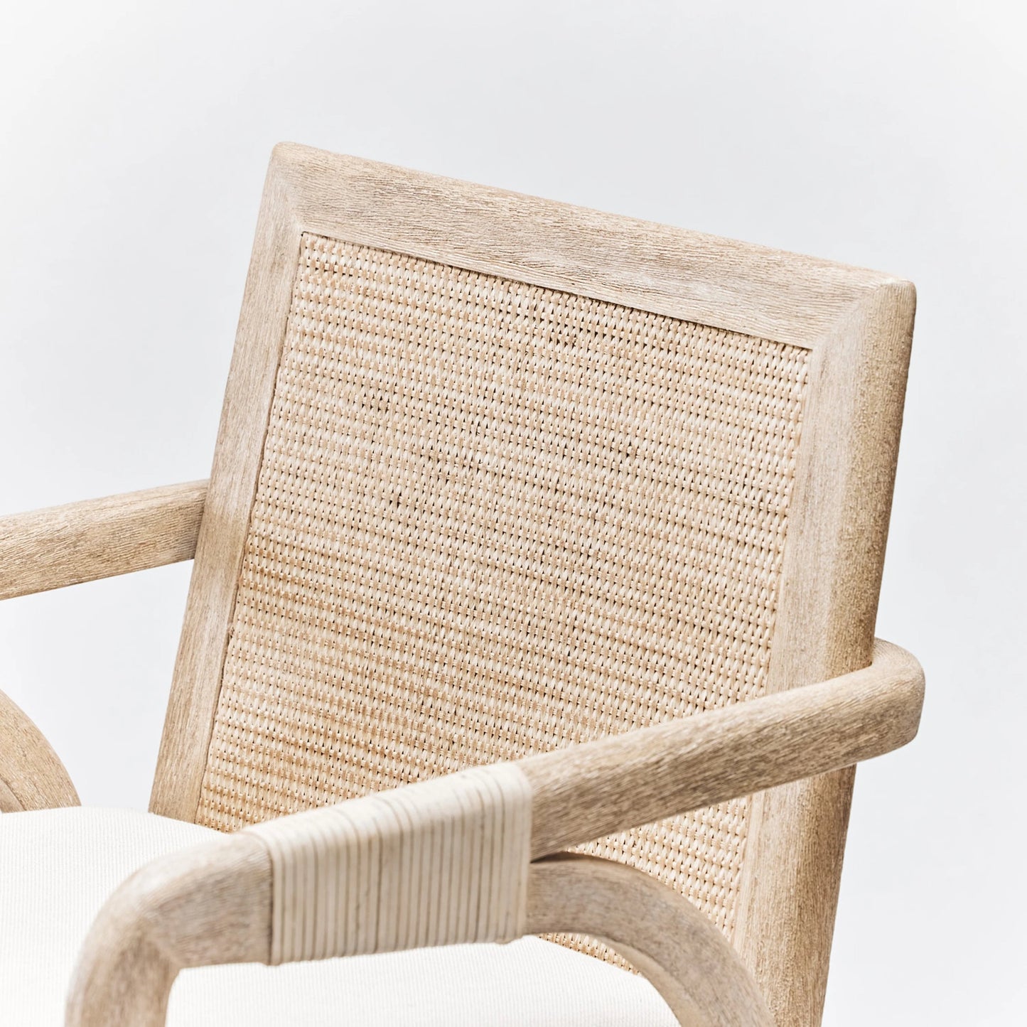 005 SI-2122843 | Closeup | Delray Arm Chair by Interlude Home in white ceruse, off white, natural. Made from mahogany, rattan, leather, flax weave in a cottage & farmhouse style.