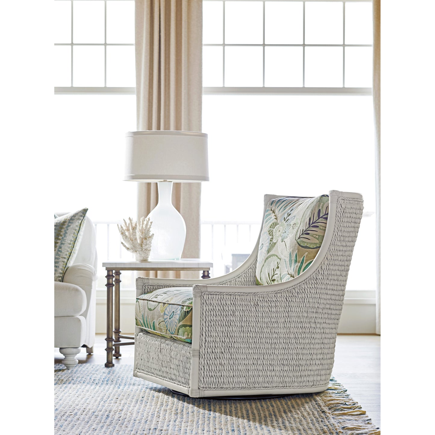 003 SR-836351 | Lifestyle | Preston Swivel Chair by Tommy Bahama Home in caribbean sands. Made from unique in a coastal style.