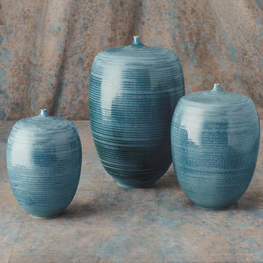 Fat Bottle by Global Views. Made from porcelain in a coastal style.