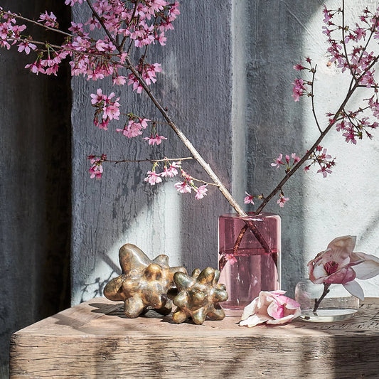 Amor Metal Object by Regina Andrew in brass. Made from aluminum in a rustic style.