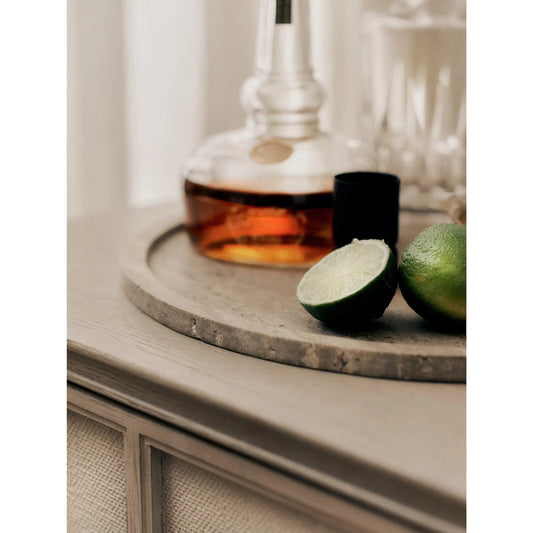 Sutton Round Travertine Tray Set by Regina Andrew in grey. Made from travertine in a unique style.