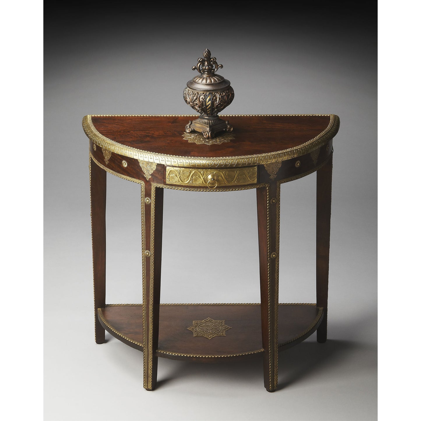 004 O-BUTLER-2054290 | Additional Silo | Ranthore Demilune Console Table by Butler Specialty Company in dark brown and artifacts. Made from mango wood solids, brass foil in a traditional style.