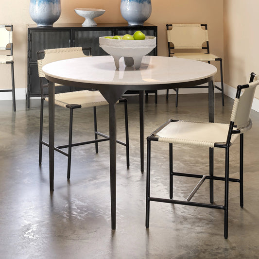 Dante Dining Table by Jamie Young in white, black. Made from white marble, metal: iron in a modern style.