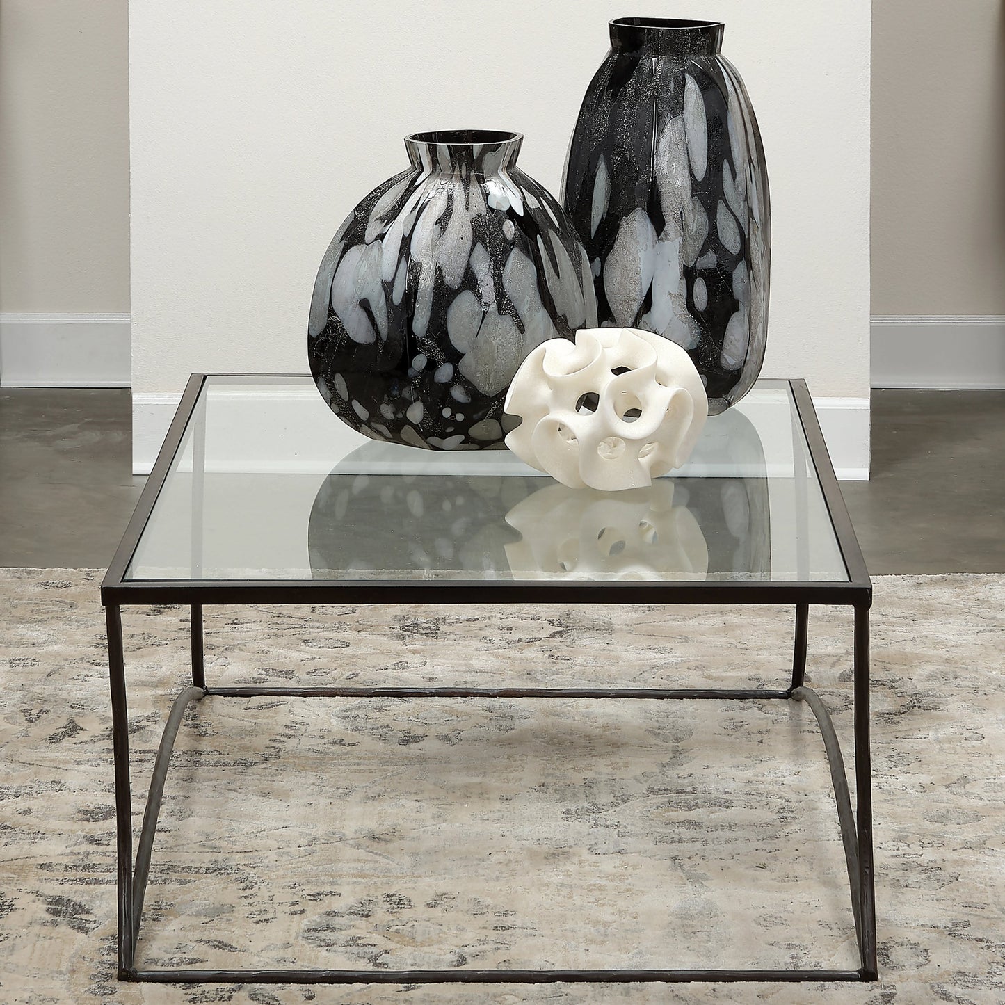 006 SI-1822202 | Lifestyle | Kai Coffee Table by Jamie Young in black. Made from forged iron, clear tempered glass top in a modern style.