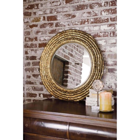 Petal Mirror by Regina Andrew in gold and gold leaf. Made from steel in a coastal style.
