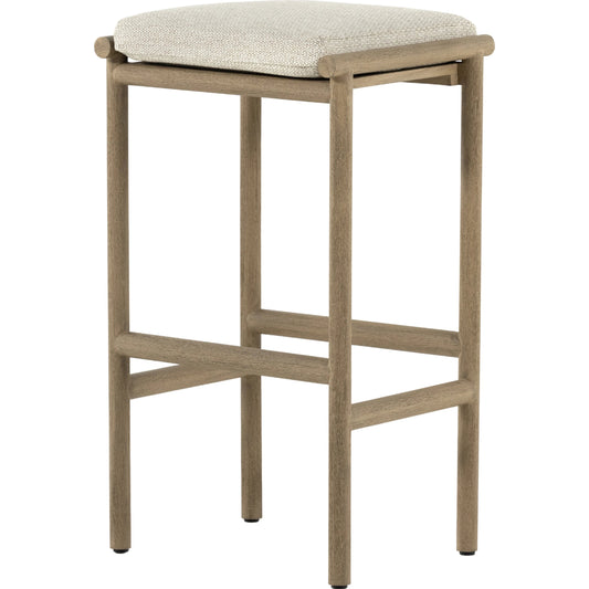Kyla Outdoor Bar Stool by Four Hands in faye sand, washed brown. Made from 100% olefin, solid fsc®-certified teak, 91% polyurethane foam pad, 9% polyester fiber batting in a cottage & farmhouse style.