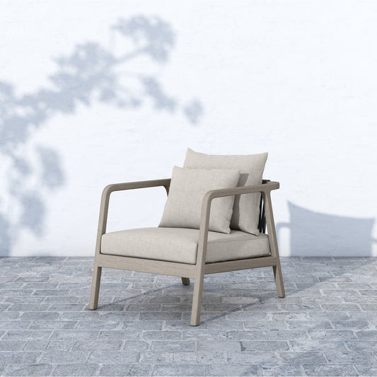 Numa Outdoor Chair - Weathered Grey by Four Hands in stone gray. Made from 100% olefin, solid fsc®-certified teak, 100% polypropylene in a coastal style.