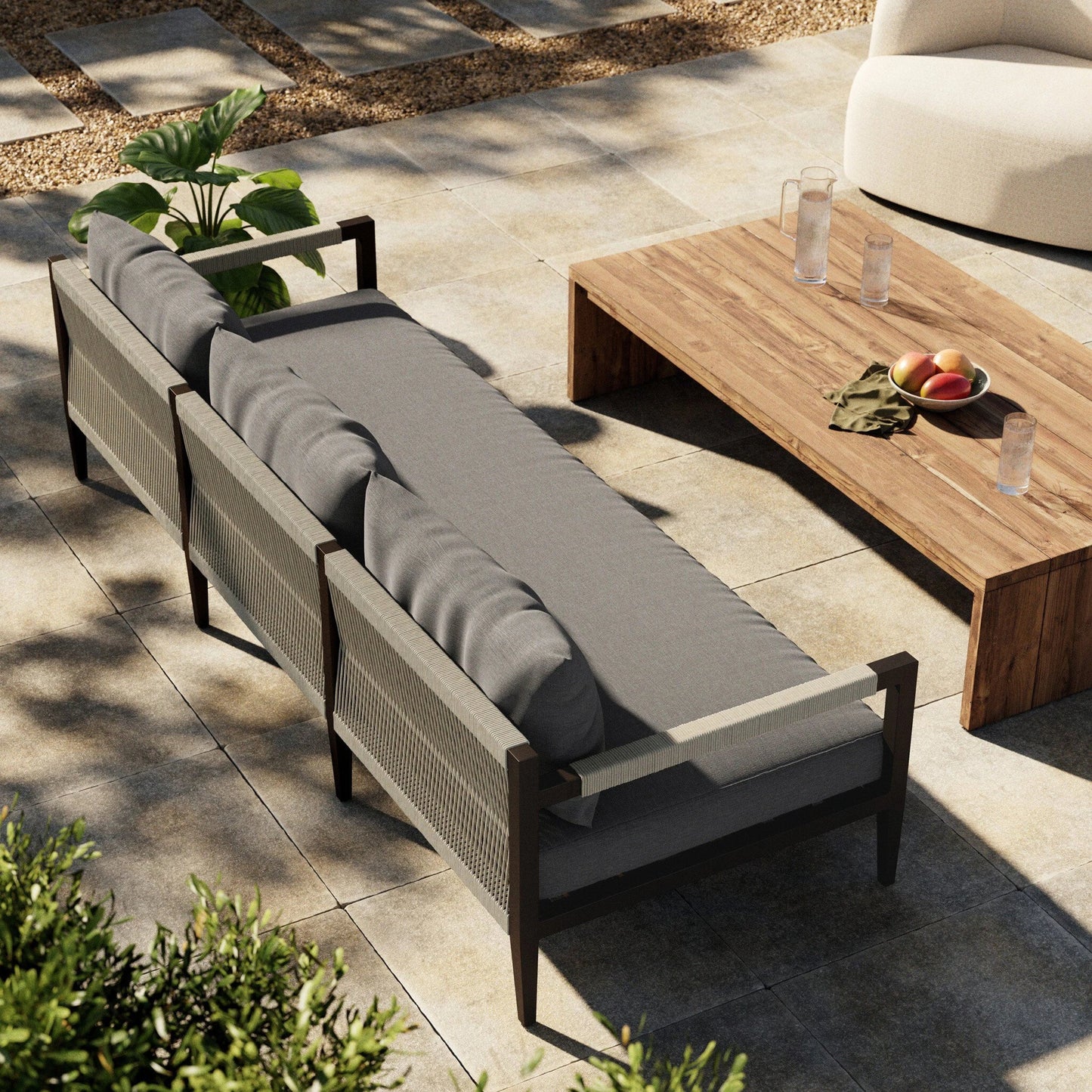 025 SI-1716738 | Lifestyle | Sherwood Outdoor Sofa, Bronze by Four Hands. Made from 100% olefin, aluminum, 100% polypropylene in a modern style.