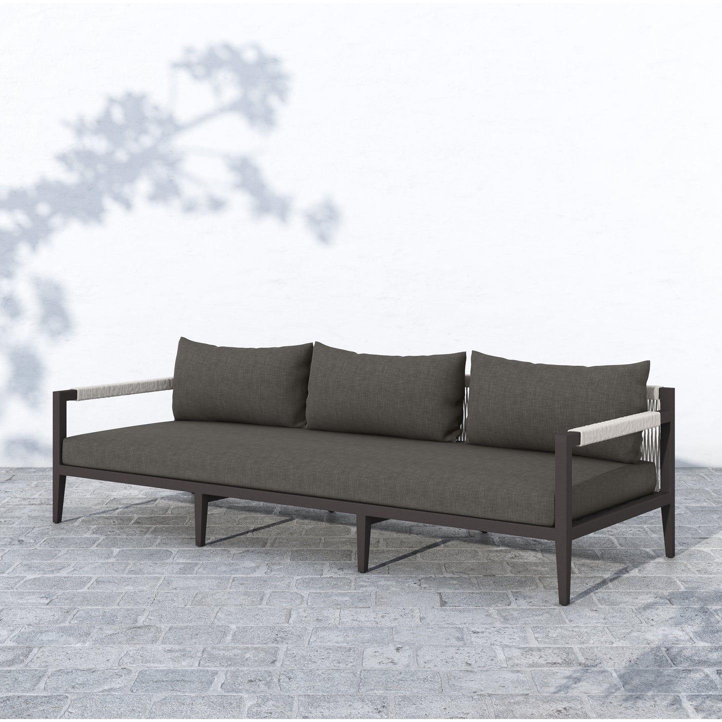 021 SI-1716738 | Lifestyle | Sherwood Outdoor Sofa, Bronze by Four Hands. Made from 100% olefin, aluminum, 100% polypropylene in a modern style.