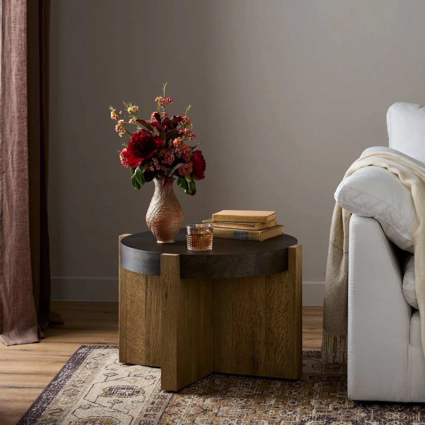 021 SI-1714454 | Lifestyle | Bingham End Table by Four Hands in rustic oak veneer, distressed iron and distressed iron. Made from thick oak veneer, engineered hardwood, iron in a rustic style.