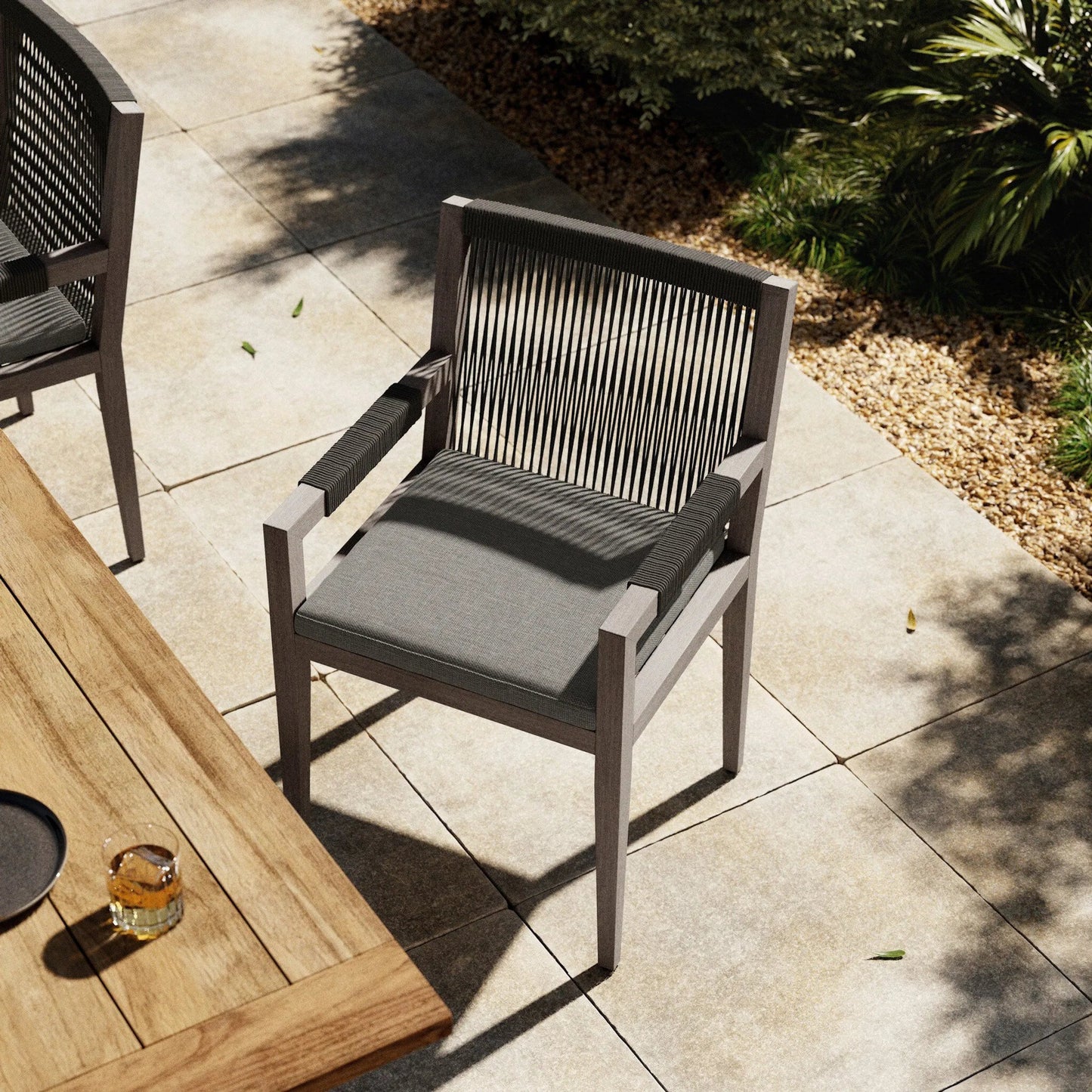 025 SI-1716720 | Lifestyle | Sherwood Outdoor Dining Armchair, Weathered Grey by Four Hands. Made from 100% olefin, solid fsc®-certified teak, 100% polypropylene in a coastal style.
