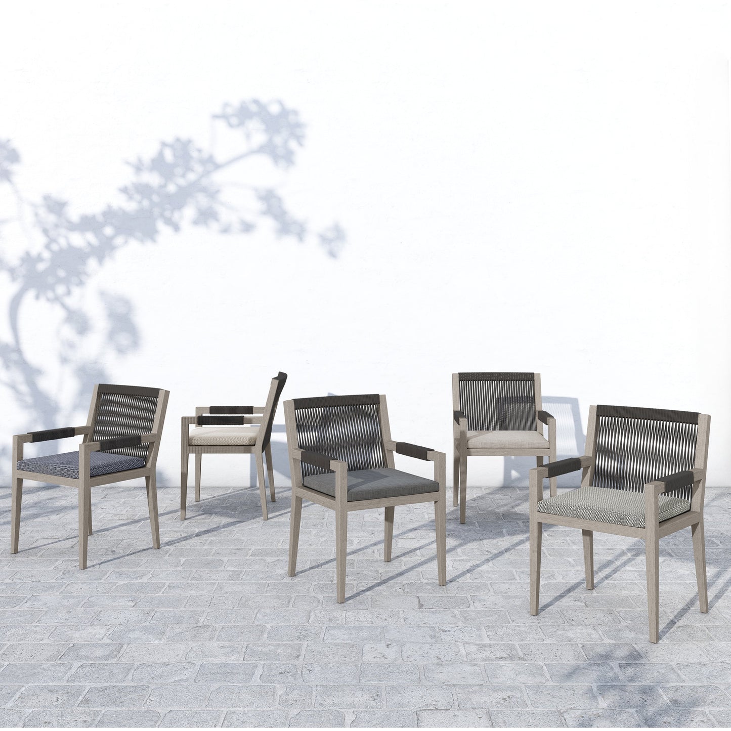 021 SI-1716720 | Lifestyle | Sherwood Outdoor Dining Armchair, Weathered Grey by Four Hands. Made from 100% olefin, solid fsc®-certified teak, 100% polypropylene in a coastal style.