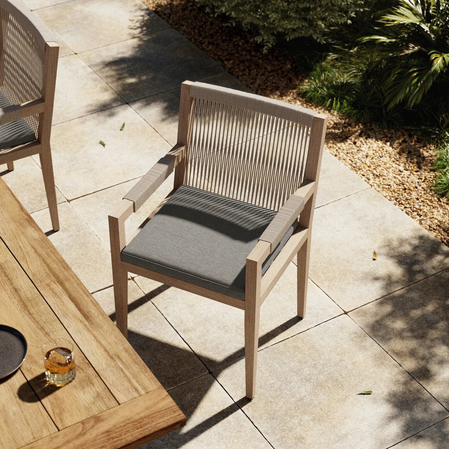 022 SR-810011 | Lifestyle | Sherwood Dining Armchair, Washed Brown by Four Hands. Made from 100% olefin, solid fsc®-certified teak, 100% polypropylene in a cottage & farmhouse style.
