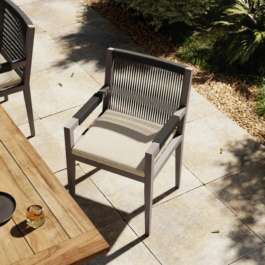 Sherwood Outdoor Dining Armchair, Weathered Grey by Four Hands. Made from 100% olefin, solid fsc®-certified teak, 100% polypropylene in a coastal style.