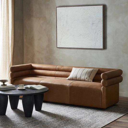 Evie Sofa by Four Hands in palermo cognac. Made from top grain leather, poplar plywood, 100% polyester in a modern style.