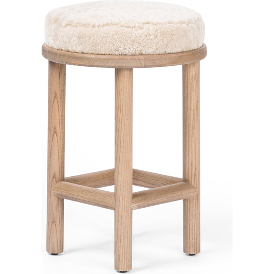Saldino Counter Stool by Four Hands in blonde nettlewood, beige shearling. Made from shearling, solid nettlewood, 100% polyester in a transitional style.