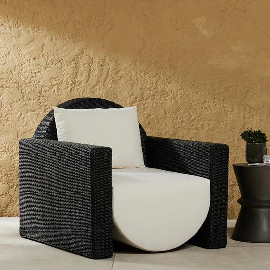 Clemente Outdoor Chair by Four Hands in vintage coal, venao ivory. Made from 100% olefin, 100% polyethylene, 59% polyurethane foam, 30% polyester fiber, 11% polyester fiber batting in a modern style.