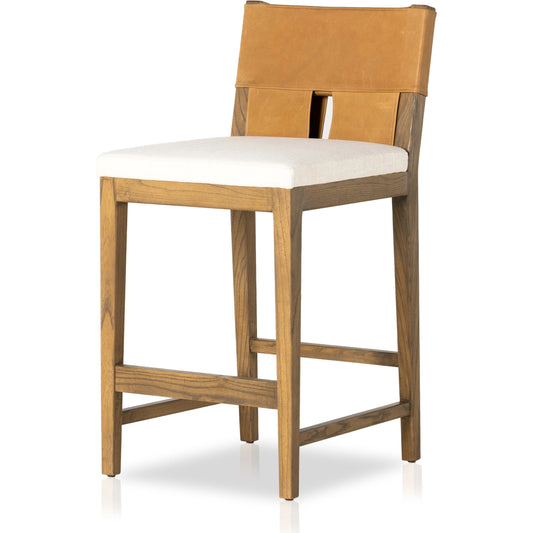 Sem Counter Stool by Four Hands in palermo butterscotch, lamont nettlewood, halcyon ivory. Made from 92% polyester, 8% flax, linen, solid nettlewood, top grain leather in a modern style.