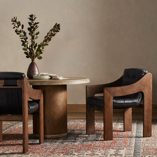 Halston Dining Armchair by Four Hands in heirloom black, terra brown ash. Made from top grain leather, solid ash, 100% polyester in a modern style.
