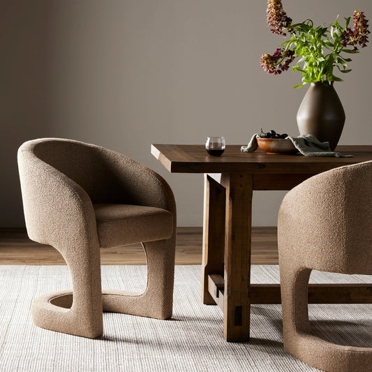 Reynold Dining Armchair by Four Hands in heron sand. Made from 34% acrylic, 24% cotton, 14% wool, 12% viscose (rayon), 12% polyester, 4% flax, linen, 80% polyurethane foam, 20% fiber, 100% polyester in a modern style.