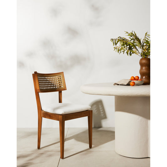 Britt Outdoor Dining Chair by Four Hands in natural teak, stinson white. Made from 100% olefin, solid teak, 100% polyethylene in a coastal style.