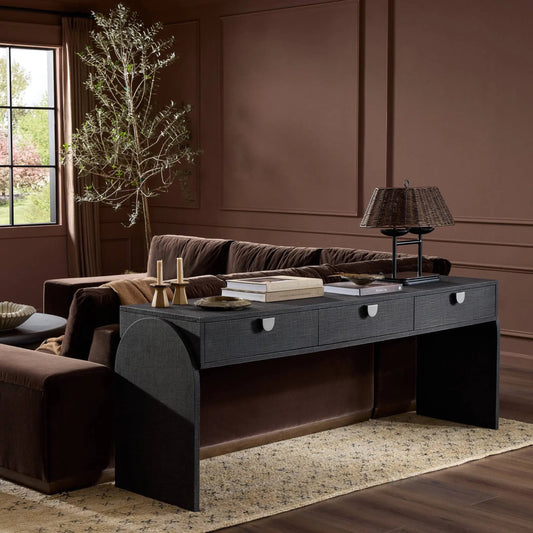 Cressida Console Table by Four Hands in light antique brass. Made from painted linen in a modern style.