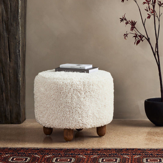 Aniston Ottoman by Four Hands. Made from unique in a transitional style.