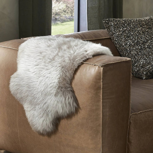 Lalo Ombre Throw by Four Hands in light grey ombre. Made from shearling in a transitional style.