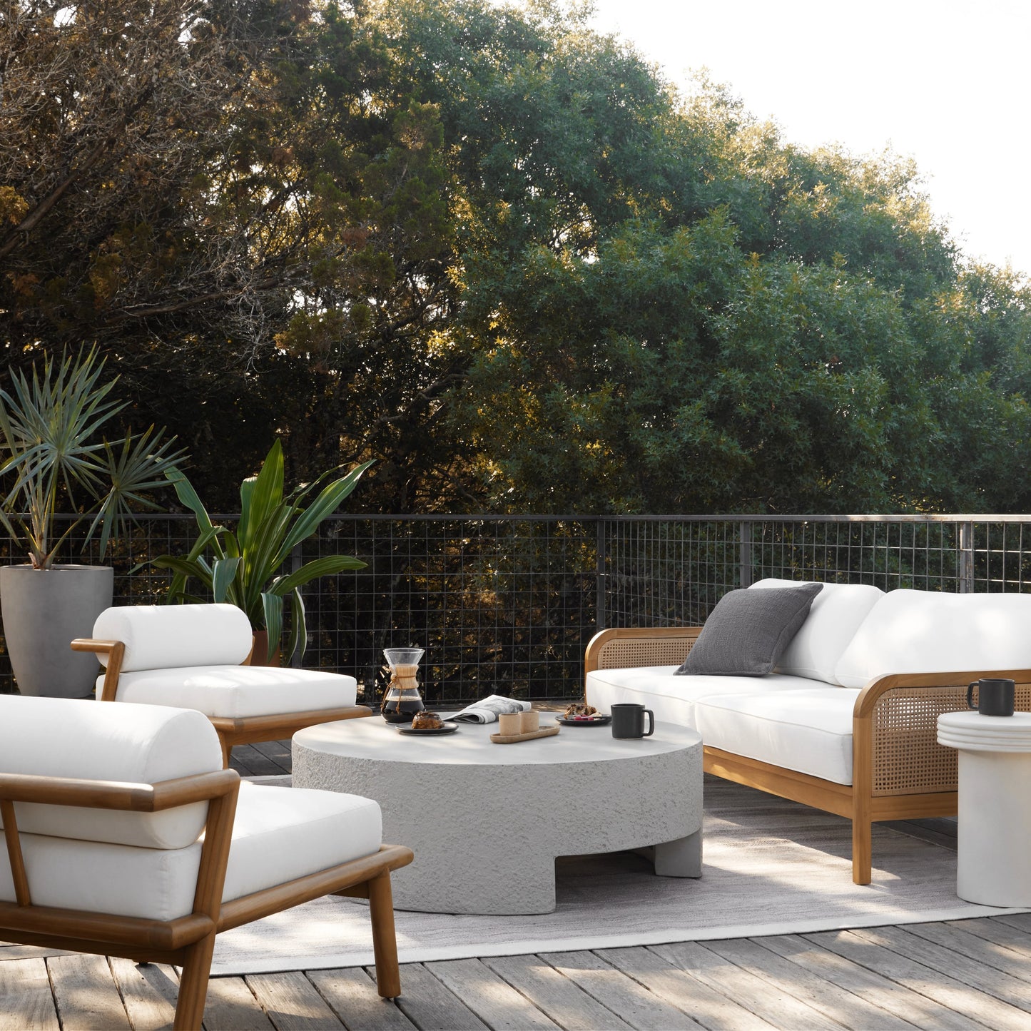 012 SI-1901869 | Lifestyle | Kember Outdoor Coffee Table by Four Hands in blanc white, matte white. Made from concrete in a modern style.