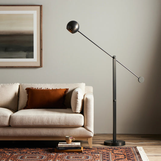 Torin Floor Lamp by Four Hands in dark antique brass. Made from stainless steel, thermoplastic, brass in a modern style.