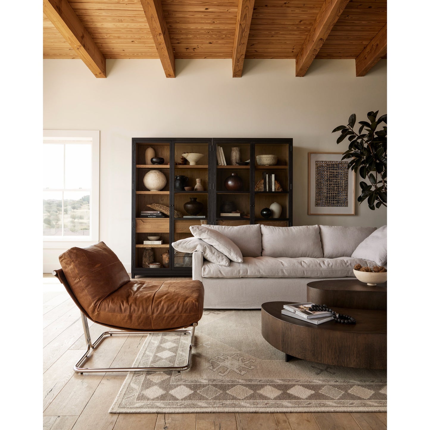 017 SI-1798102 | Lifestyle | Millie Double Cabinet by Four Hands in tempered glass, drifted black, drifted oak and matte black, drifted oak. Made from solid oak, oak veneer in a modern style.