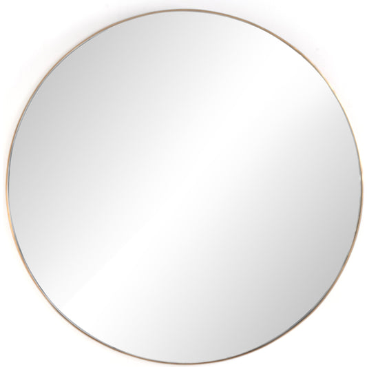 Georgina Mirror Round by Four Hands in polished brass. Made from aluminum, mirror, engineered hardwood in a modern style.