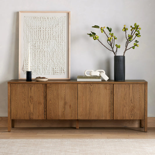 Riggs Media Console by Four Hands in amber oak. Made from solid oak in a transitional style.